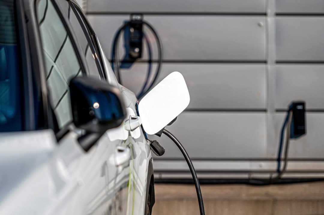 Electric vehicle charger plugged into a charging socket