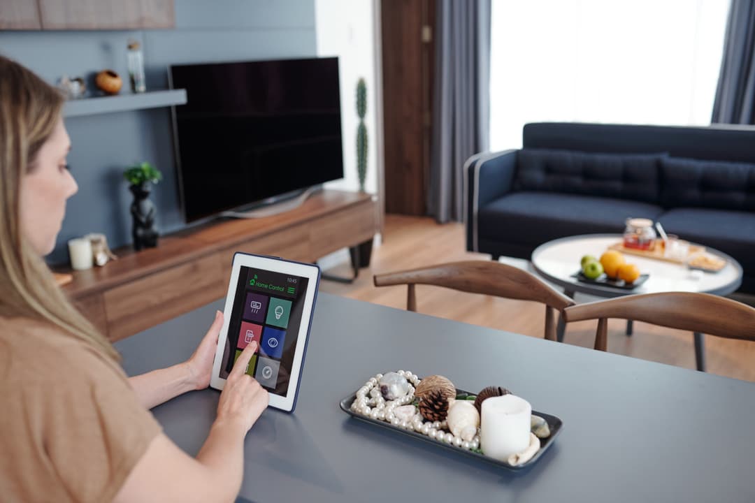 Smart home controls on a tablet in a living room