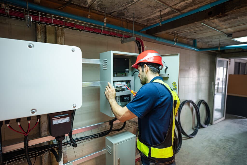 Service engineer inspecting an electrical installation